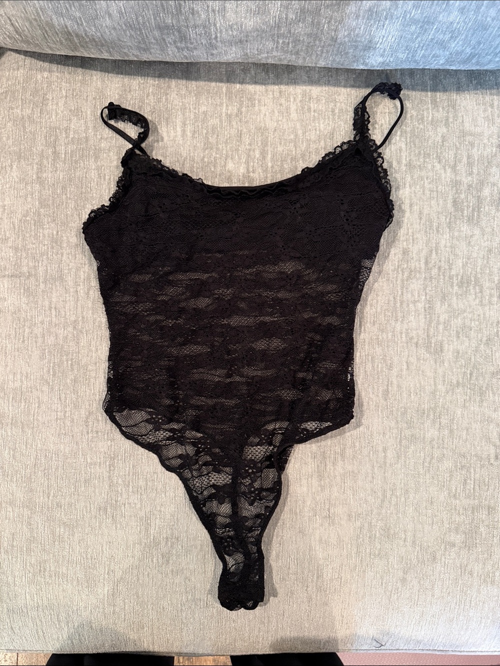 Lacey black body suit crotch snaps. Worn only once!